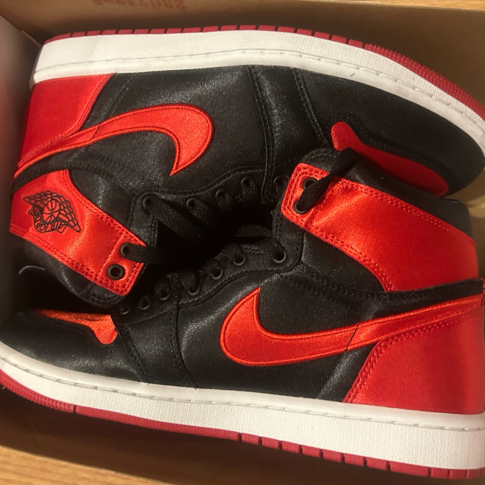 Ladies air jordan.size 9.5 Black and red satin